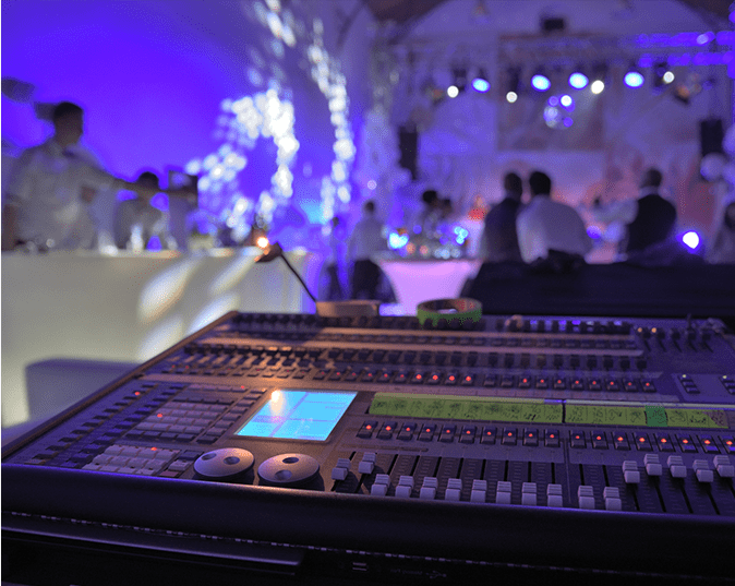 A large sound board in front of a crowd.